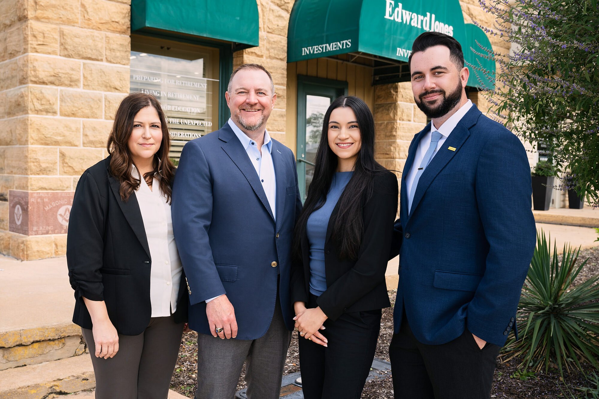 A financial advisory team photographed outside their own office by Ryan Dunbar