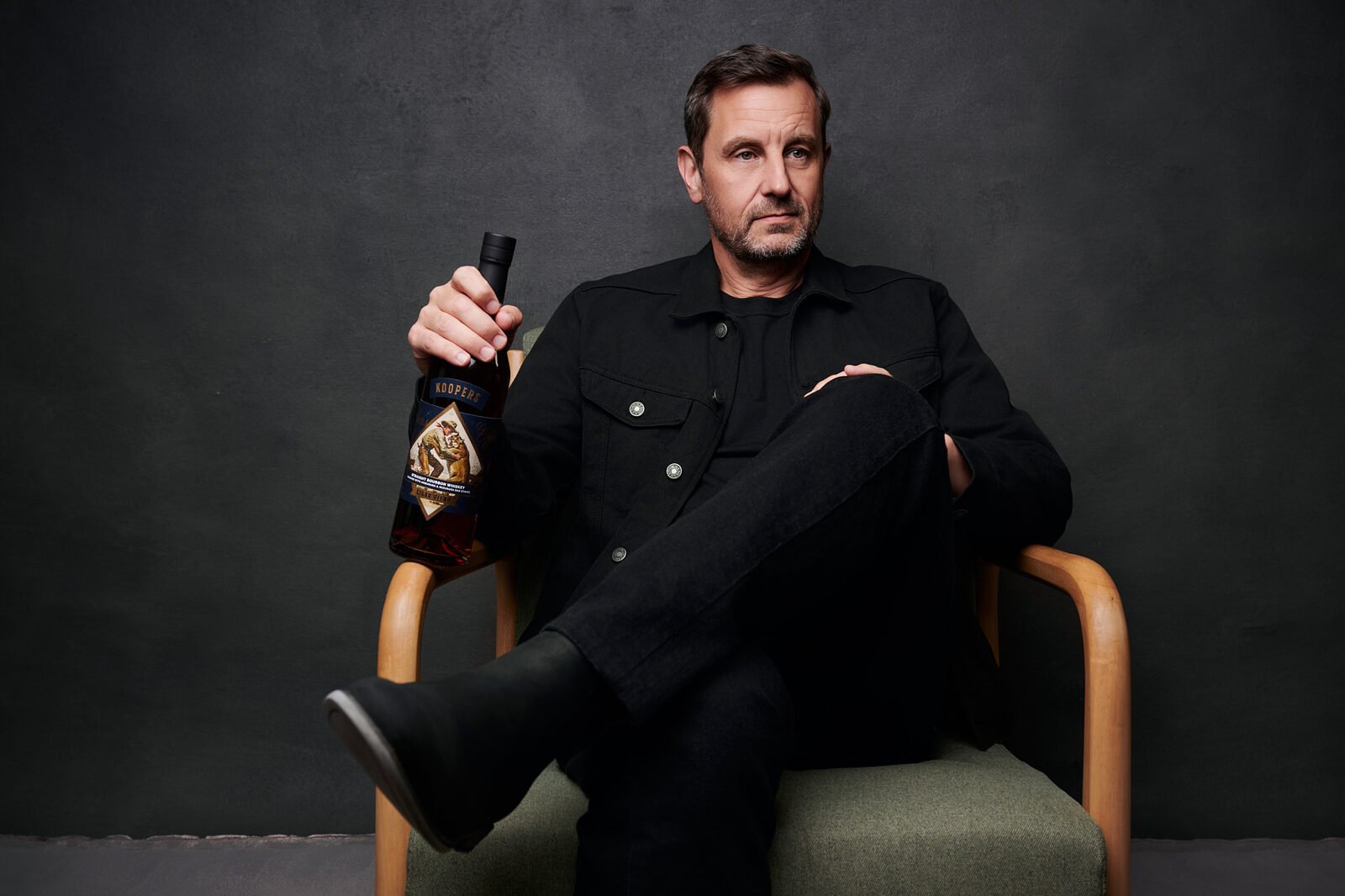 A company founder photographed seated by Ryan Dunbar